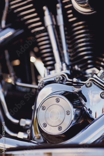 motorcycle engine close up with polished chrome and reflections