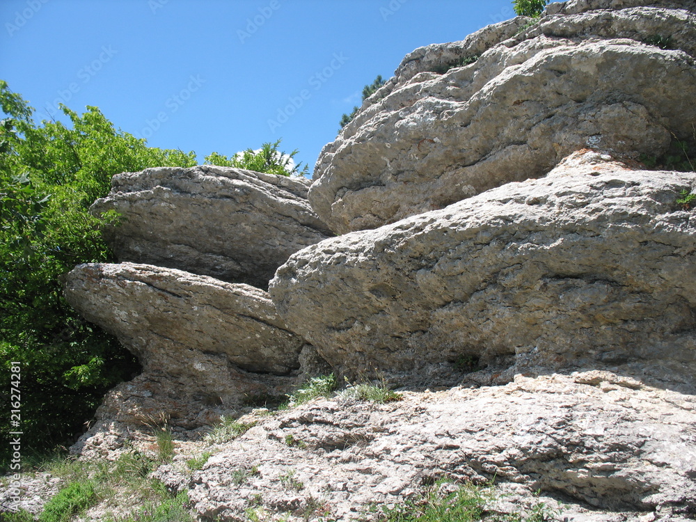 ery bright mountain slopes with plants and blue sky and clouds on the mountain ai-petri