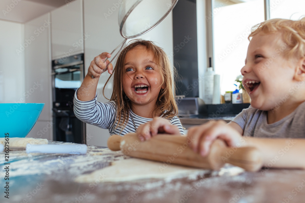 Kids having fun while making cookies Kids having fun while making cookies