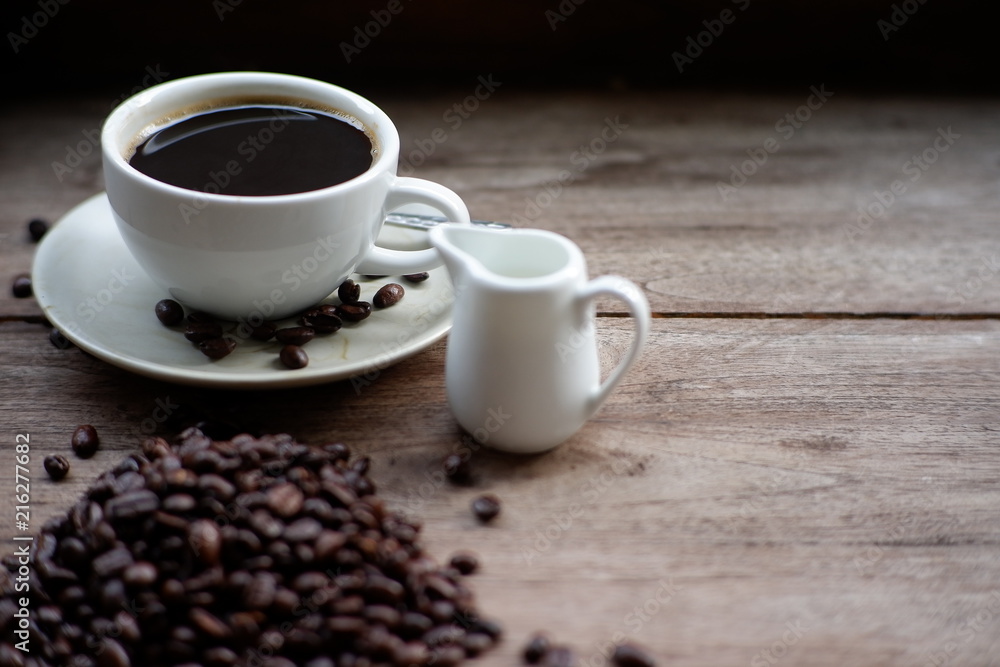 coffee cup and coffee bean on old wood table coffee cup and coffee bean on old wood table
