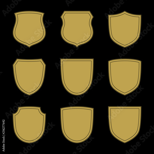 Shield shape gold icons set. Simple silhouette flat logo on black background. Symbol of security, protection, safety, strong. Element for secure protect design emblem Vector illustration