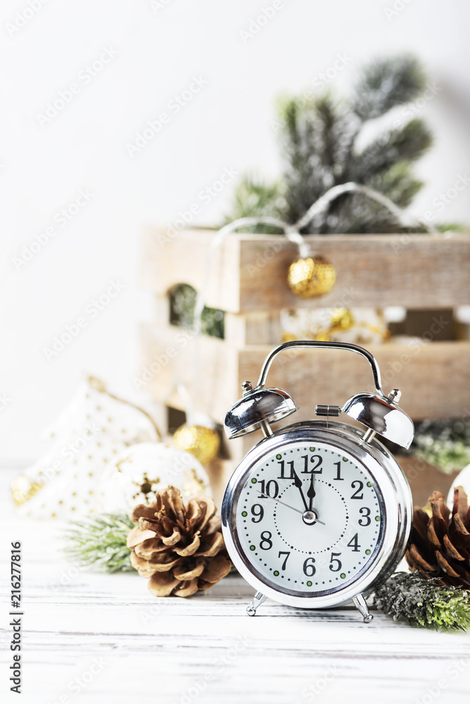 Christmas card with clock and christmas ornament, selective focus