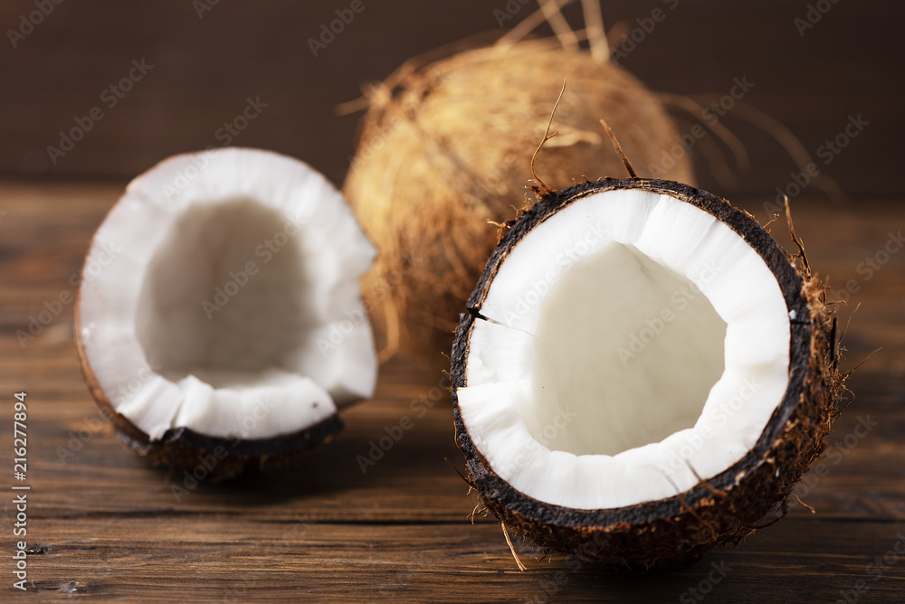 Fresh coconut on the wooden table Fresh coconut on the wooden table