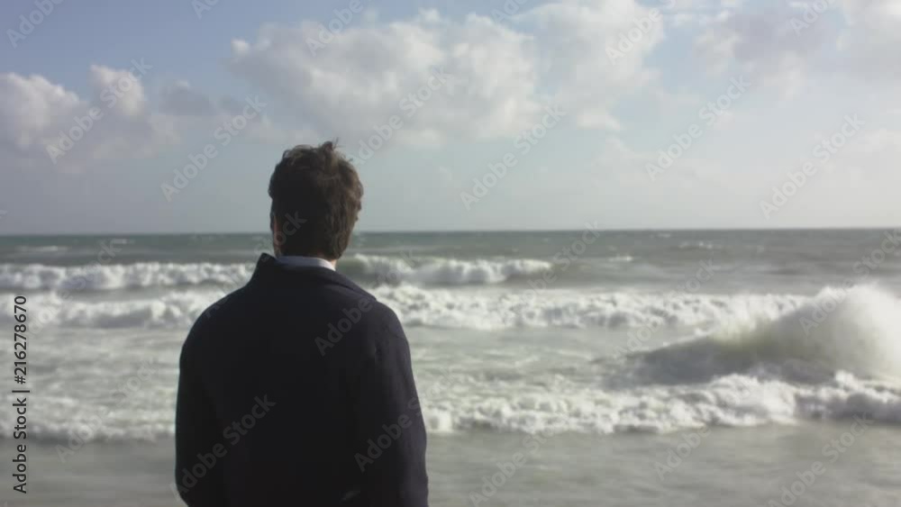 A Conceived Man Walking On Ocean Beach A Conceived Man Walking On Ocean Beach
