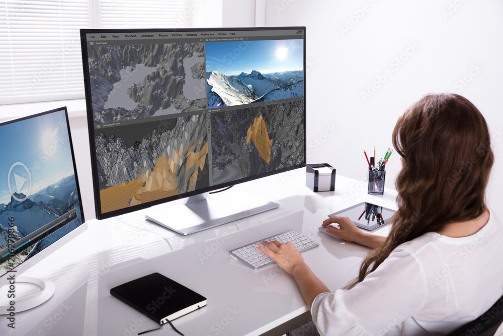 Woman Rendering 3D Landscape On Computer Woman Rendering 3D Landscape On Computer
