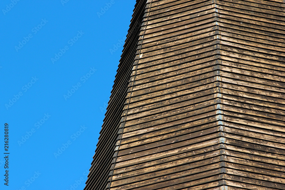 Weathered wooden planks on tower of old church in Voss, Hordaland county, Norway Weathered wooden planks on tower of old church in Voss, Hordaland county, Norway