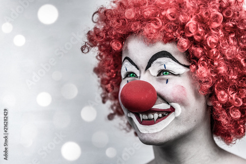 Fototapeta Naklejka Na Ścianę i Meble -  Vampire girl clown with crazy make up scary but cute party invitation card