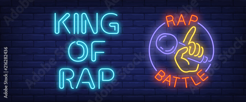 King of rap, rap battle neon style banner. Text and hand holding microphone on brick background. Night bright advertisement. Can be used for signs, posters, billboards