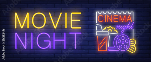 Movie, cinema night neon style banner. Text, popcorn, film reel, clapper board on brick background. Night bright advertisement. Can be used for signs, posters, billboards