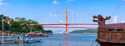 Namhae Bridge and Yi Sun-sin turtle ship in Namhae County, South Gyeongsang Province, Korea photo