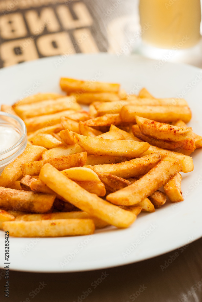 French fries on a white plate French fries on a white plate