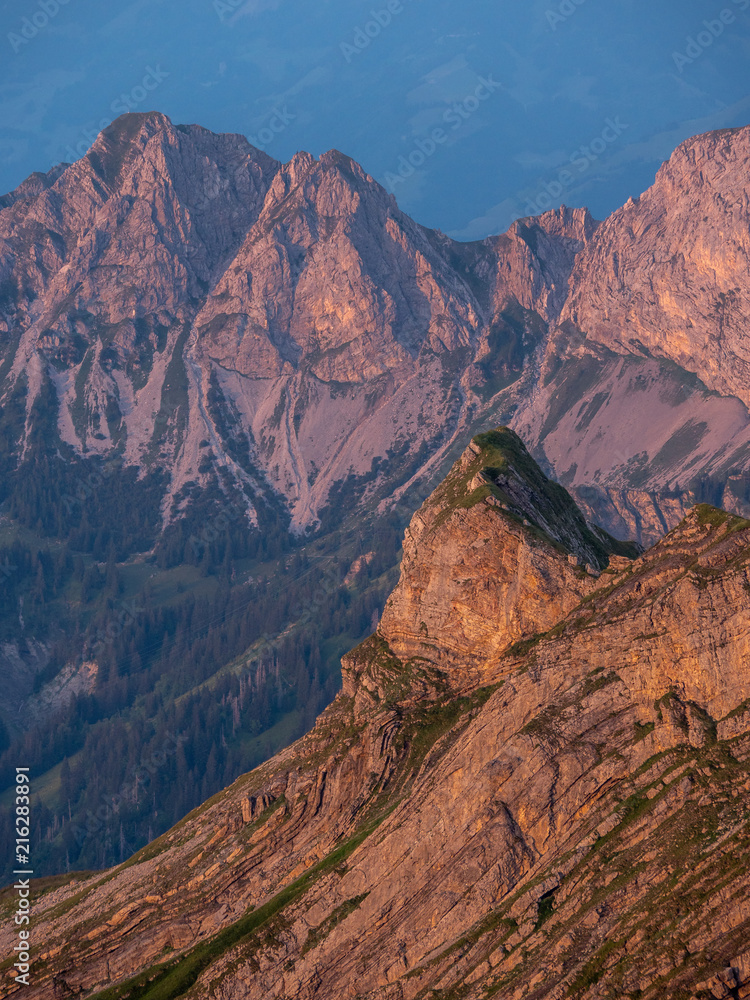 mountain peak during sunset golden hour the swiss alps, brienzer rothorn vertical