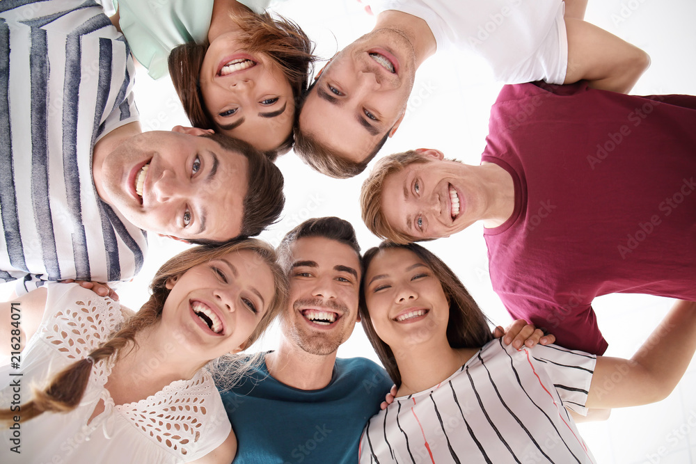 People standing together, view from below. Unity concept People standing together, view from below. Unity concept