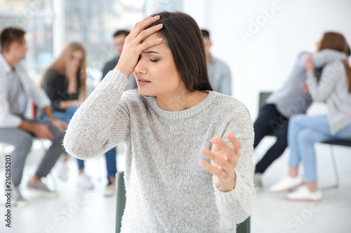 Stressed woman during group...