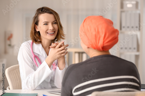 Woman with cancer visiting doctor in hospital photo