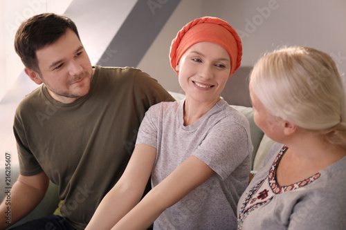 Family visiting young woman...