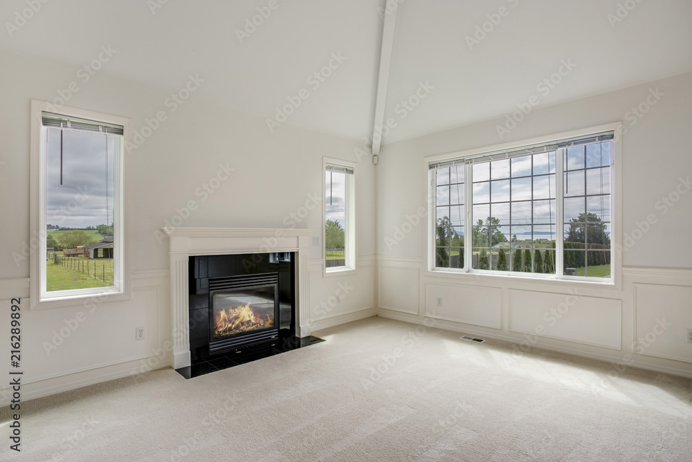 White empty living room filled with sunlight. White empty living room filled with sunlight.