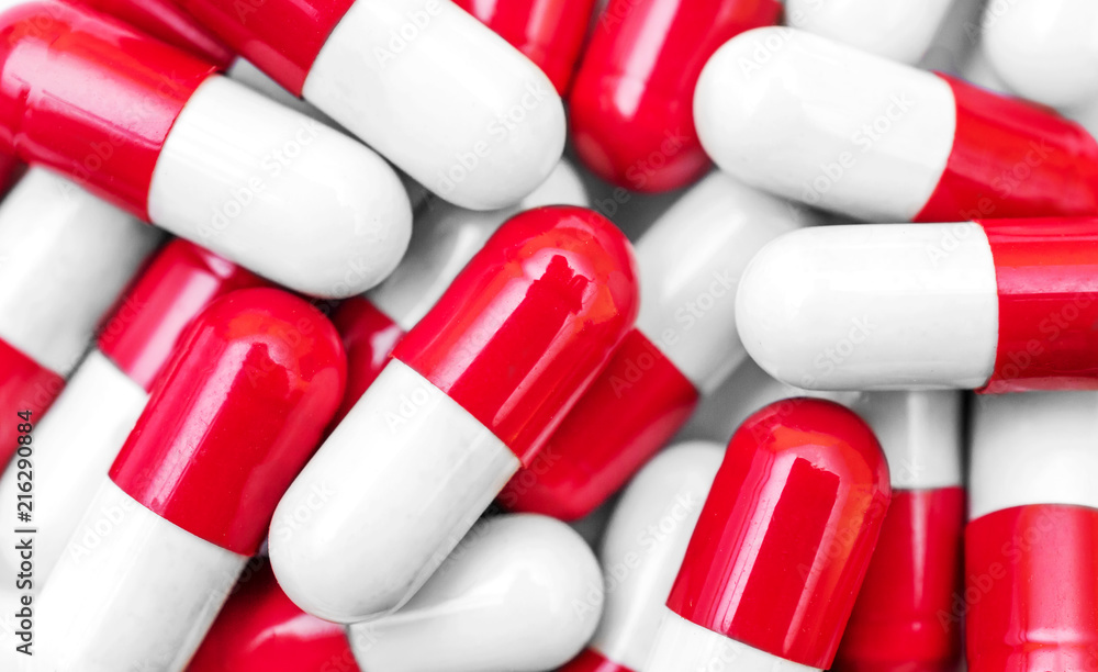 Red-white capsules as medical background. Red-white capsules as medical background.
