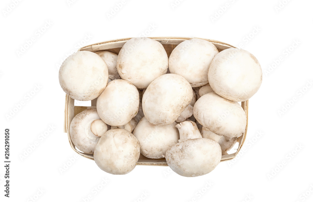 Champignons in wooden box on white background. top view.