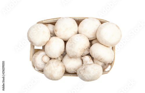 Champignons in wooden box on white background. top view.