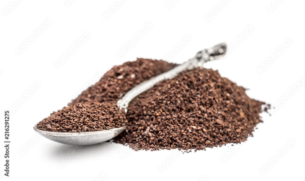 Heap of ground coffee with spoon on white. Heap of ground coffee with spoon on white.