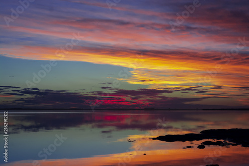 Colorful sunset on the lakeshore in Carhue, Argentina
