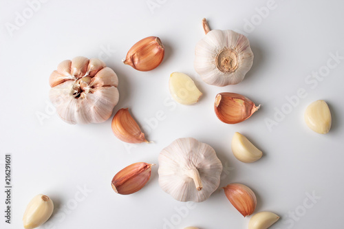 Modern art of garlic with segments isolated on white background.