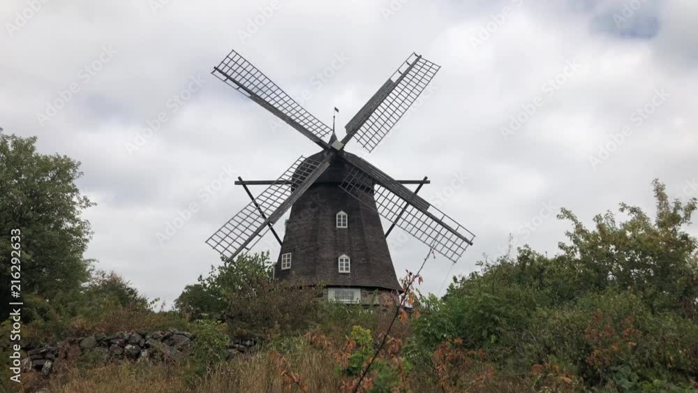 Still shot of an old windmill by the countryside Still shot of an old windmill by the countryside