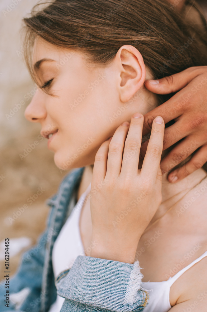 happy tender attractive girl and boyfriend touching her neck happy tender attractive girl and boyfriend touching her neck