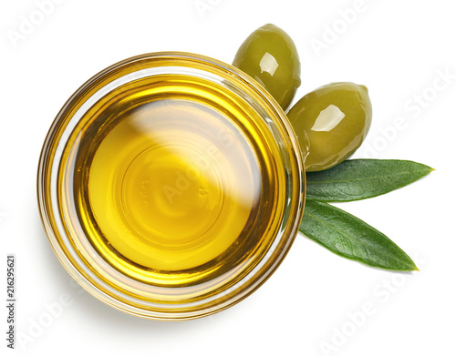 Fotografie, Obraz Bowl of olive oil and green olives with leaves
