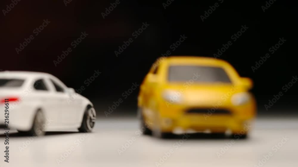 SLOW MOTION: Collision of two toy cars on a street - Macro SLOW MOTION: Collision of two toy cars on a street - Macro