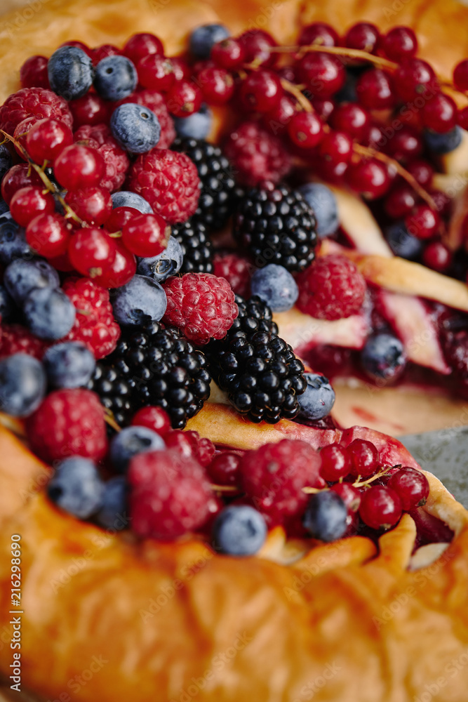close up of tasty berries pie with raspberries, currants, blueberries and blackberries close up of tasty berries pie with raspberries, currants, blueberries and blackberries