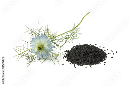  Heap of black nigella seeds and flower