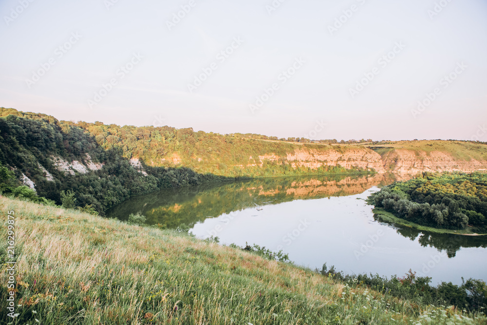 landscape meandering channel rocks canyons green vegetation