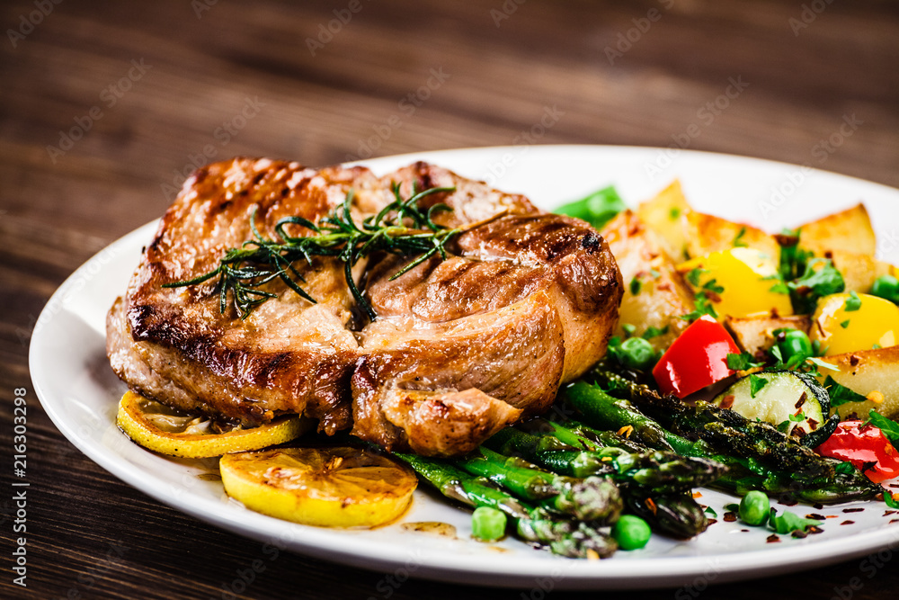 Grilled steak with french fries and vegetables Grilled steak with french fries and vegetables