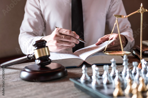 Wallpaper Mural Legal law, advice and justice concept, Professional male lawyers working on courtroom sitting at the table and signing papers with gavel and Scales of justice Torontodigital.ca