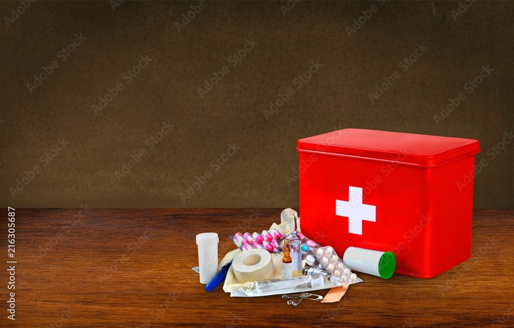 Fototapeta premium First aid kit with medical supplies