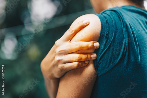 woman having pain in shoulder , health care concept photo