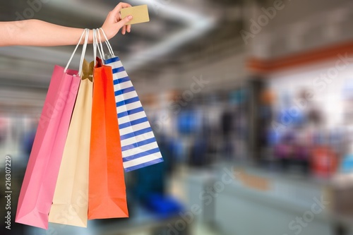 Woman with shopping bags and card