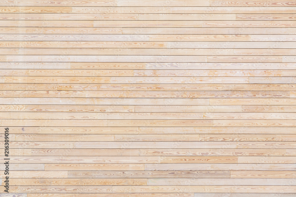 Texture of wooden slats. Many beige planks on the photo. Texture of wooden slats. Many beige planks on the photo.