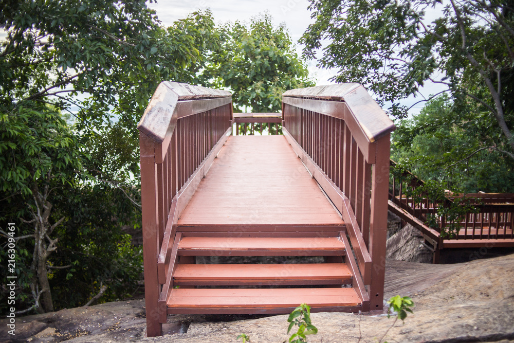 wood staircase on  mountain stone