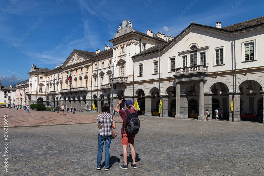 ITALY, AOSTA - JULY 8: Aosta is located region in the Italian Alps. View to the central square of. city in morning time on 8 July 2018 Aosta, Italy.
