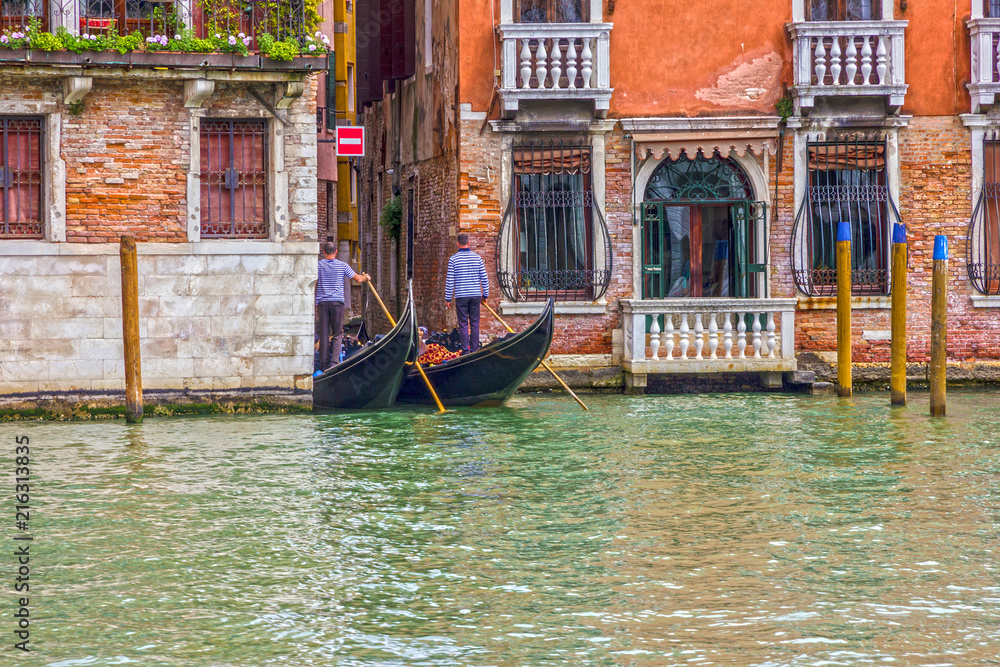 Gondoliers in Venice Grand canal, Italy