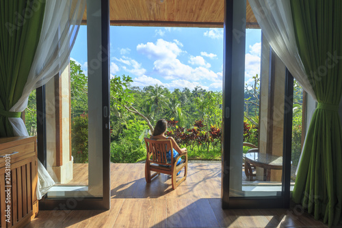 A woman is relaxing in the garden in the house