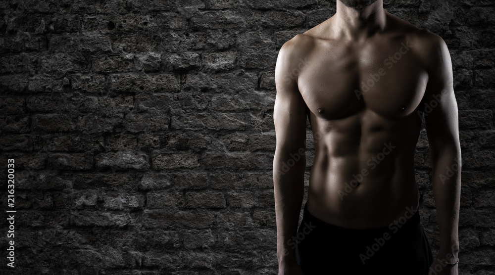 Fototapeta premium Muscular of a body building trainer man