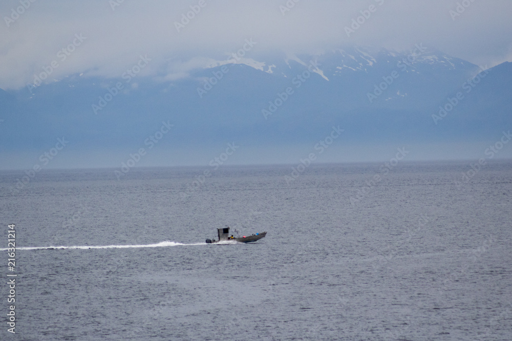 Fototapeta premium Boat with mountains far away