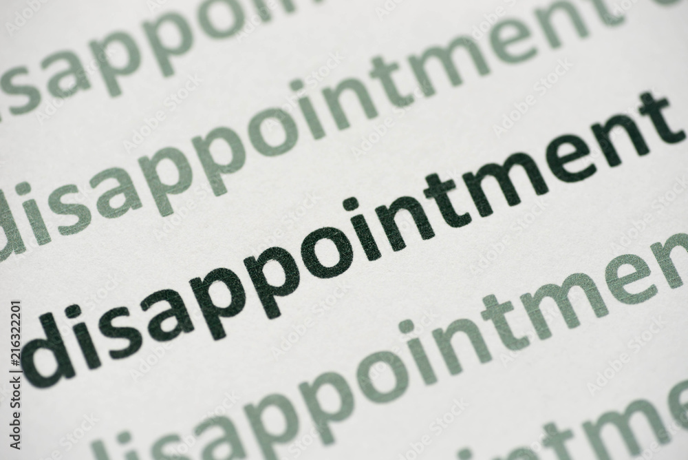 Obraz premium word disappointment printed on paper macro