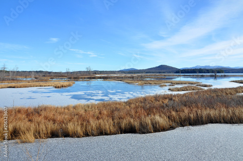 Tupper Lake in winter with snow in town of Tupper Lake, Adrondack Mountains, New York, USA.