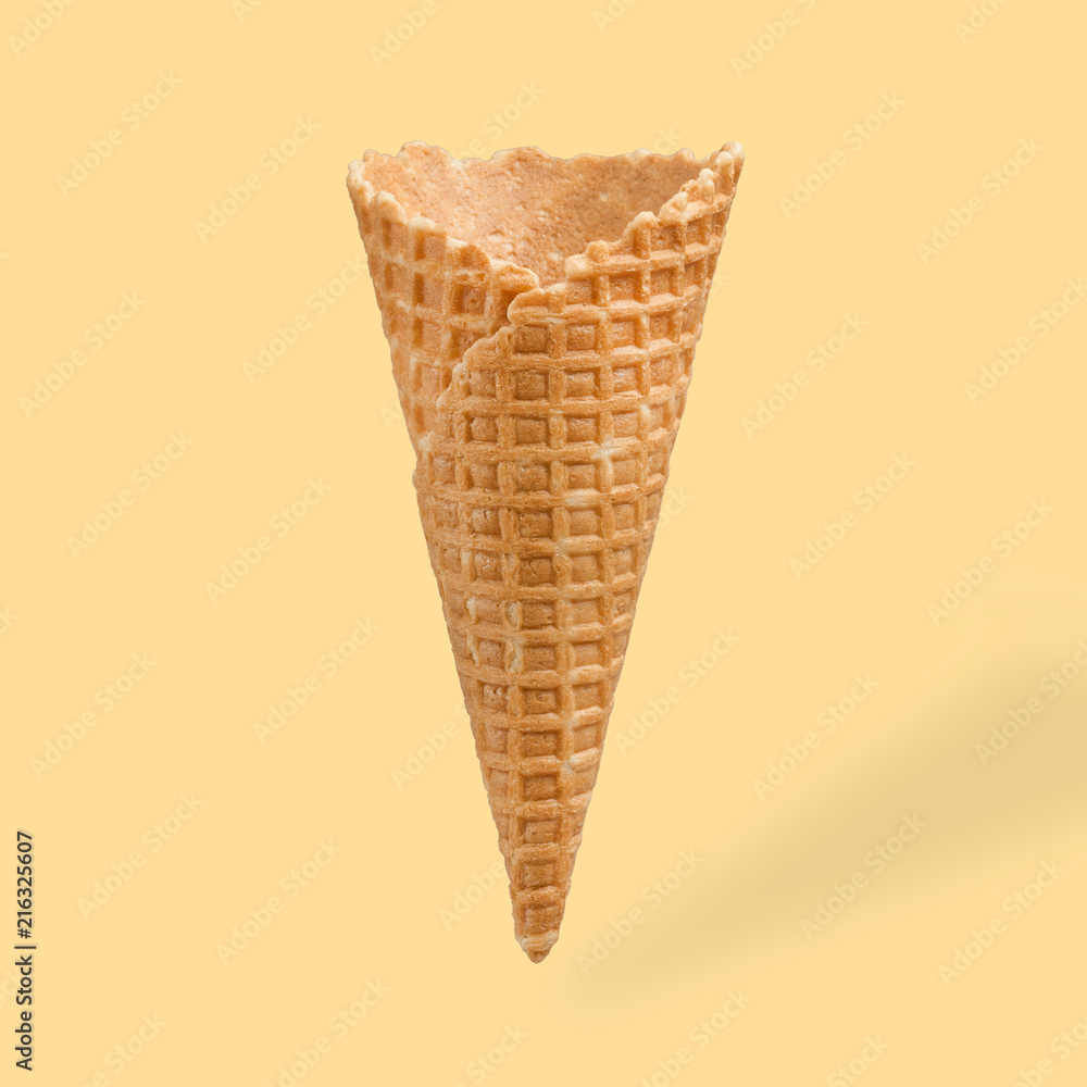 empty ice cream cone, on an orange background empty ice cream cone, on an orange background