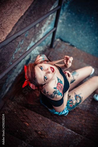 young alternative tattoo woman pin up. Beauty portrait top view 